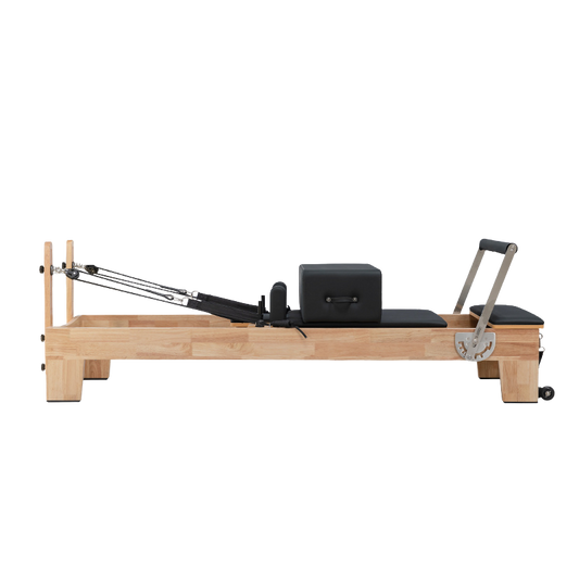 Classic Oak Core Pilates Reformer with black upholstery – full front view on white background